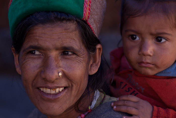 Chitkul lady carrying a child on her back