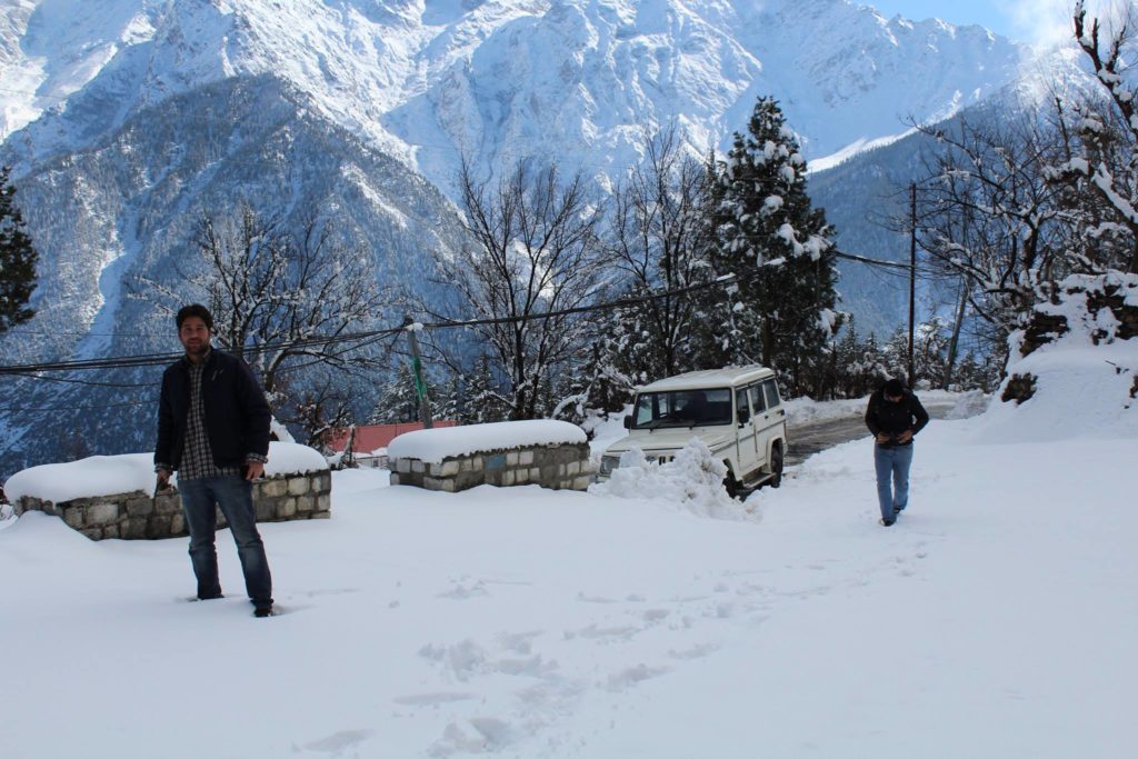 Hiking in deep snow near Kalpa football ground in Kinnaur
