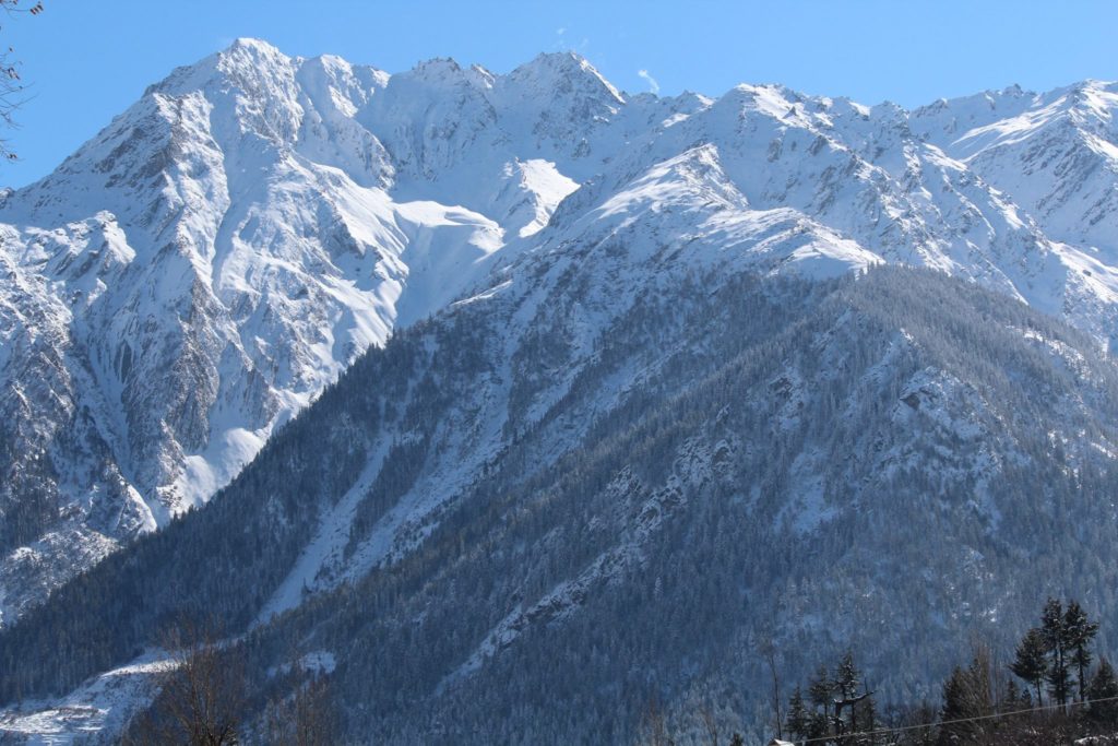 Snowy mountain tops above Barang village in Kinnaur