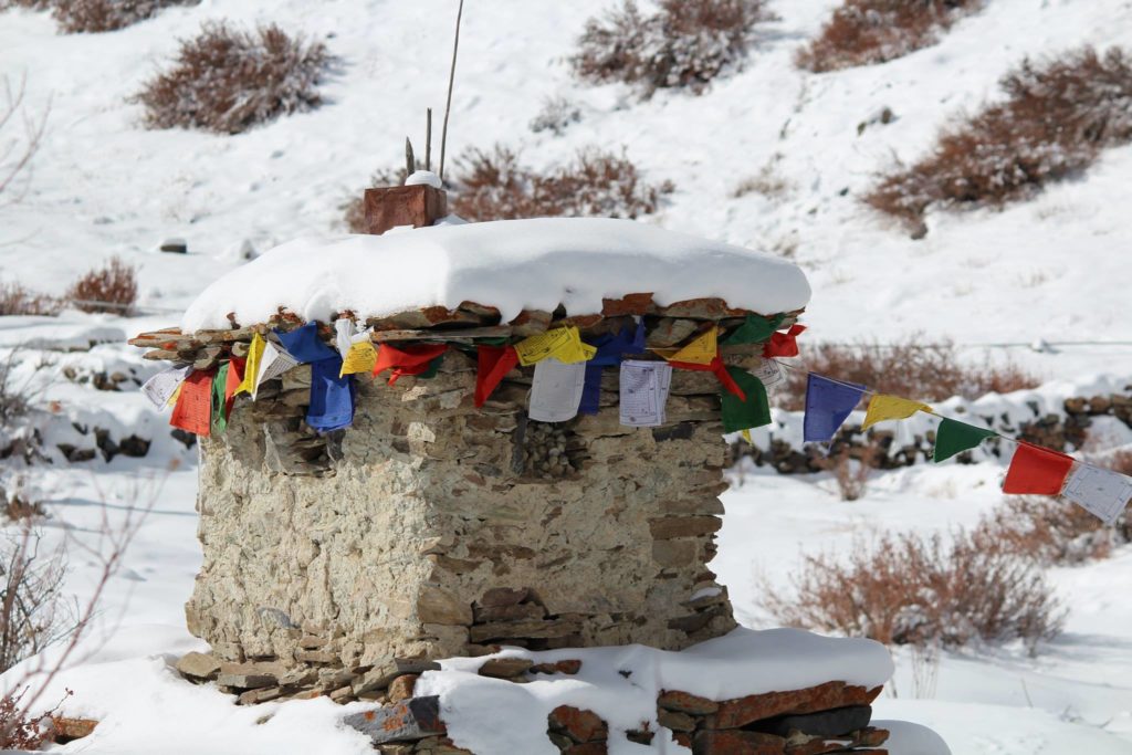 snow covered Chorten in Charang village of Kinnaur