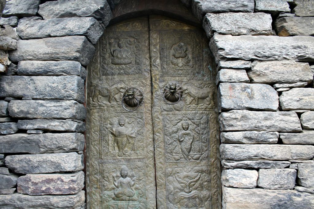 Beautiful Carvings on a metal door , Kamru fort compound , Baspa valley , Kinnaur