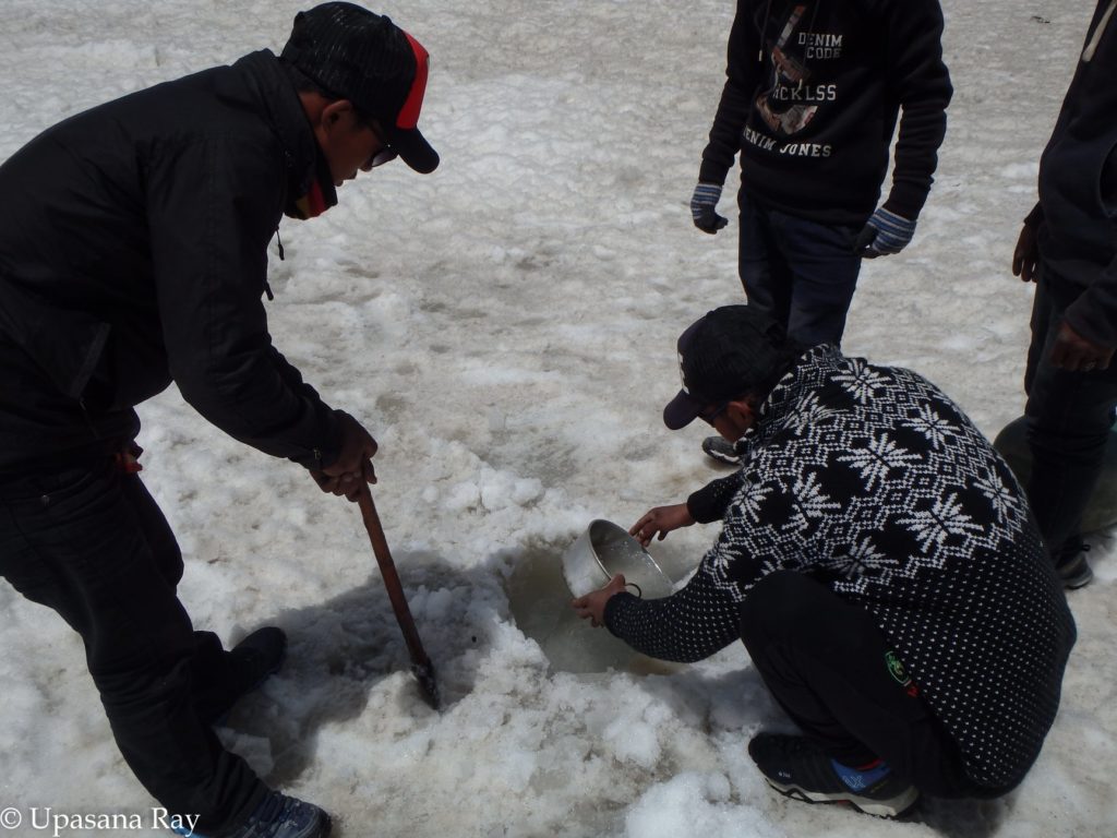 Trying to dig out some water from beneath the glacier at advance base camp[Lamkhaga pass 2018]