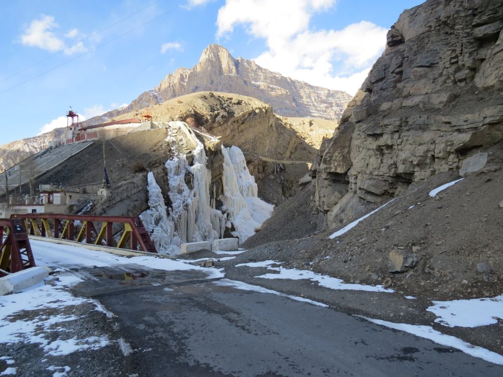 Frozen Lingti waterfall by the cantilever Lingti bridge