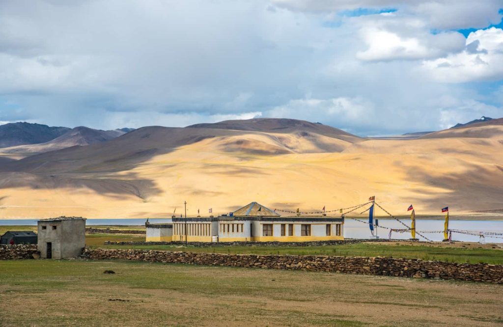 Player flag fluttering on the banks of Tso Moriri Lake