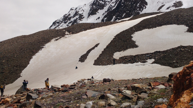 Rajeev giving us demo on how to slide down in snow in Lamkhaga lower basecamp