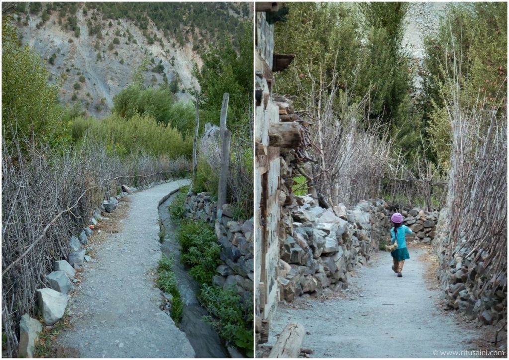 a kid walking through the streets of Ropa village 