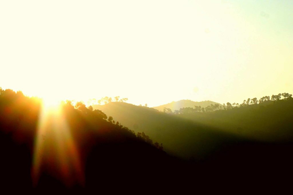 Sun rises over the Nepalese jungle near the Makhali river