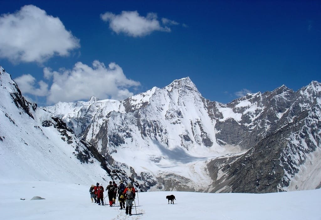 Walking on snowfield in upper Kyarkoti valley