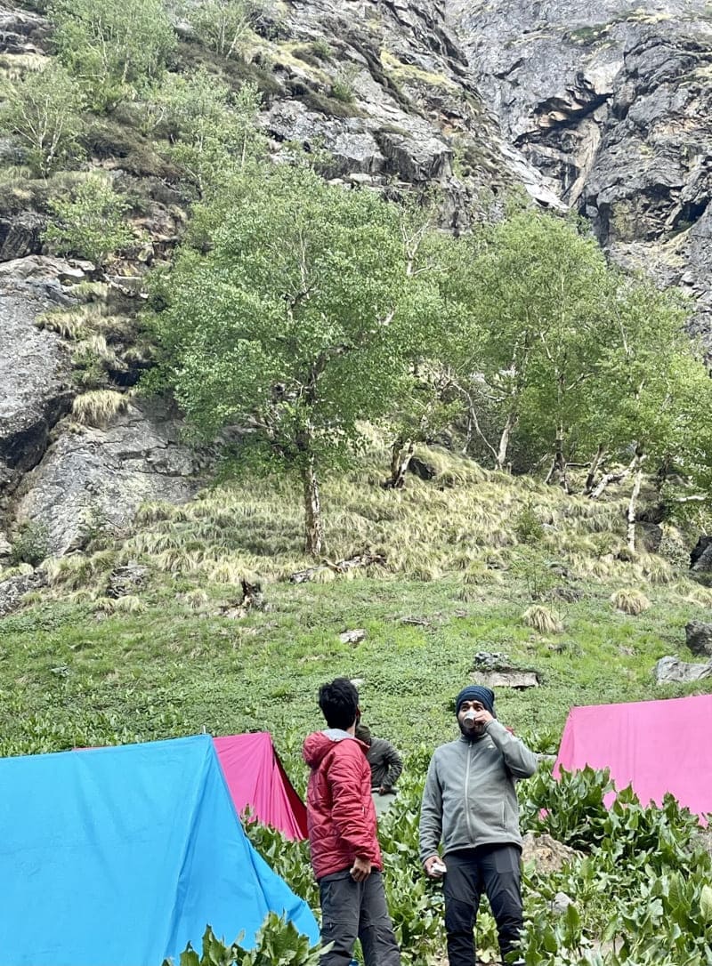 People sipping tea by the Bhojkharak camp site