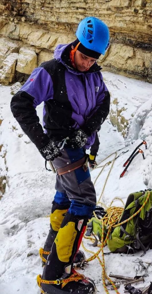 Locking carabiners before starting the climb