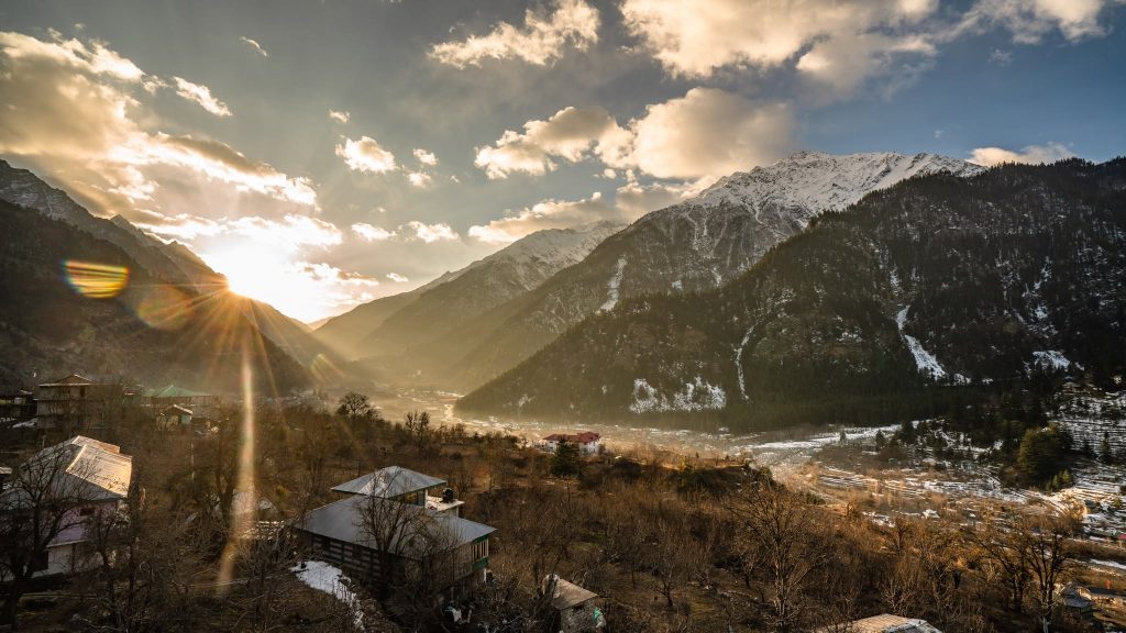 Sun setting over the valley of Sangla during golden dusk hours