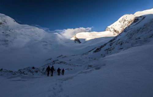 Negotiating the glacier. Auden's col in background
